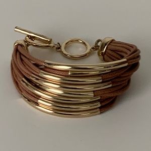 Strap & gold tone bar bracelet.